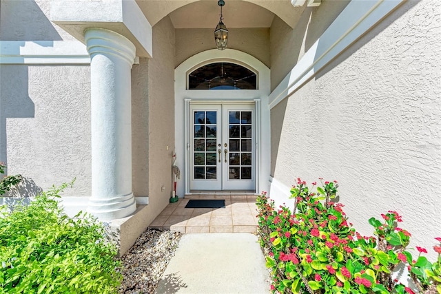 11915 Oak Ridge Dr, Parrish, FL 34219 - view of exterior entry with french doors and stucco siding