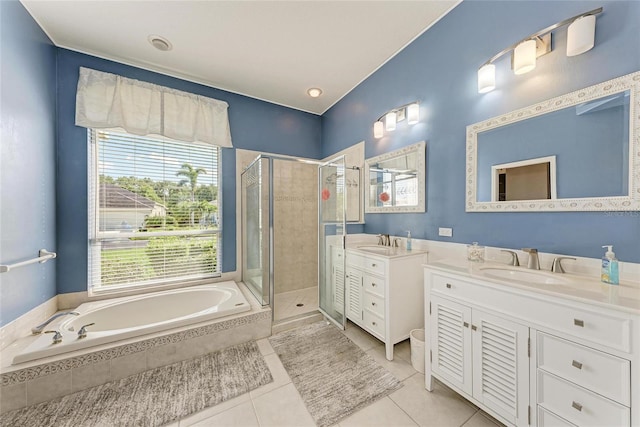 11915 Oak Ridge Dr, Parrish, FL 34219 - full bathroom featuring a stall shower, healthy amount of natural light, two vanities, and a bath