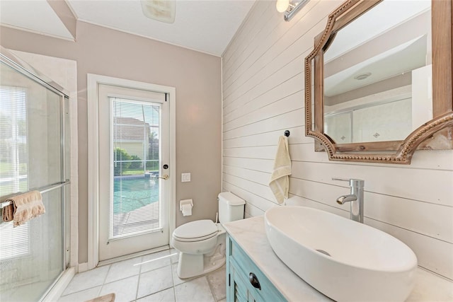 11915 Oak Ridge Dr, Parrish, FL 34219 - bathroom with wooden walls, a stall shower, tile patterned floors, and vanity