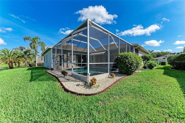 11915 Oak Ridge Dr, Parrish, FL 34219 - back of property with a lawn and an outdoor pool
