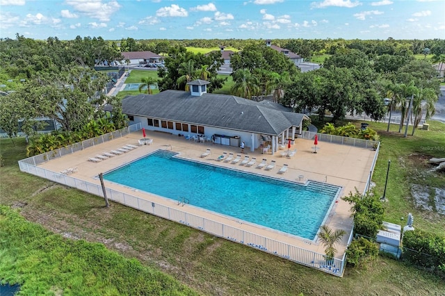 11915 Oak Ridge Dr, Parrish, FL 34219 - community pool featuring a patio, an outbuilding, and view of wooded area