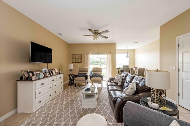 3698 Parkridge Cir Unit 26-104, Sarasota, FL 34243 - living area featuring baseboards and ceiling fan