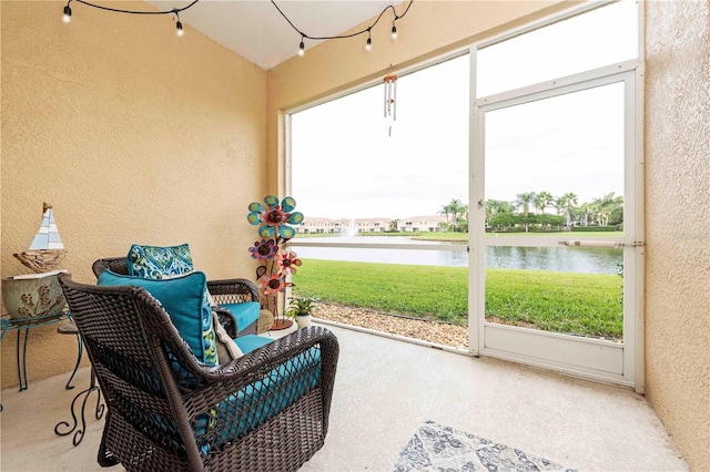 3698 Parkridge Cir Unit 26-104, Sarasota, FL 34243 - sunroom featuring a water view