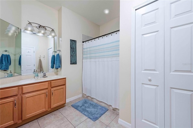 3698 Parkridge Cir Unit 26-104, Sarasota, FL 34243 - bathroom with vanity, tile patterned floors, a closet, and a shower with shower curtain