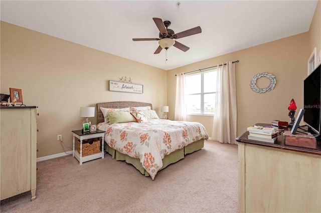 3698 Parkridge Cir Unit 26-104, Sarasota, FL 34243 - bedroom with light carpet and a ceiling fan