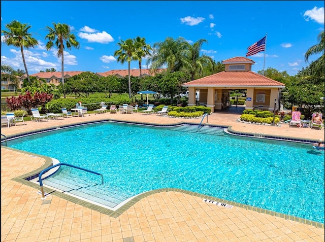 3698 Parkridge Cir Unit 26-104, Sarasota, FL 34243 - community pool with a patio