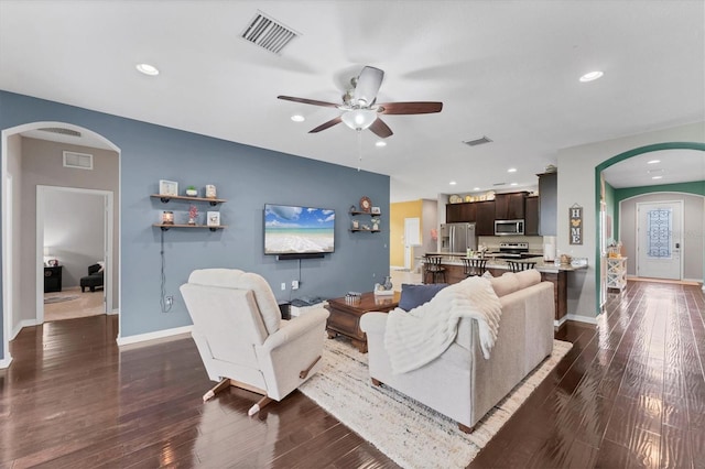 9123 Raes Creek Pl, Palmetto, FL 34221 - living room featuring arched walkways, ceiling fan, dark wood finished floors, and recessed lighting
