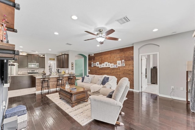 9123 Raes Creek Pl, Palmetto, FL 34221 - living room with a ceiling fan, arched walkways, recessed lighting, and wood finished floors