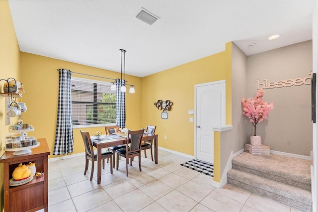 9123 Raes Creek Pl, Palmetto, FL 34221 - dining area with light tile patterned floors and stairway