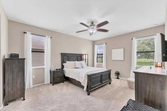 9123 Raes Creek Pl, Palmetto, FL 34221 - bedroom with light colored carpet and ceiling fan