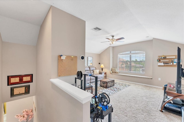 9123 Raes Creek Pl, Palmetto, FL 34221 - living area with vaulted ceiling, carpet, and ceiling fan
