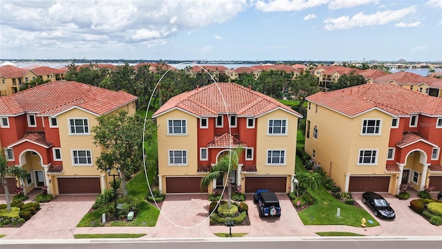 1512 3rd Street Cir E, Palmetto, FL 34221 - view of front of house featuring stucco siding, a garage, and a residential view