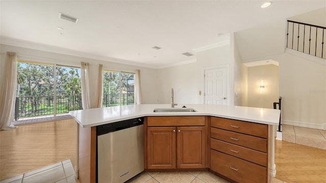 1512 3rd Street Cir E, Palmetto, FL 34221 - kitchen featuring dishwasher, light countertops, light tile patterned flooring, brown cabinetry, and ornamental molding