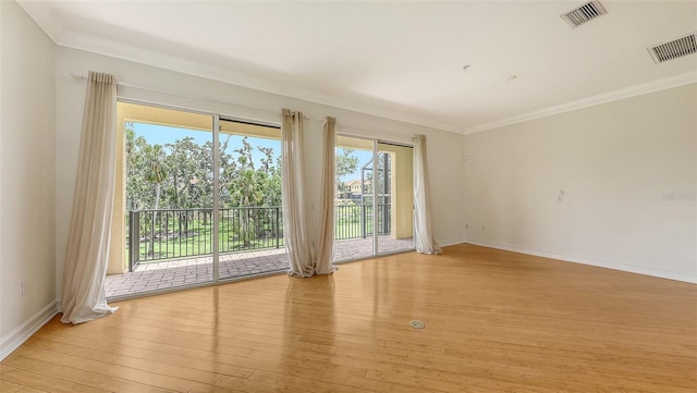 1512 3rd Street Cir E, Palmetto, FL 34221 - unfurnished room featuring light wood-style flooring and crown molding