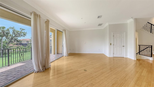 1512 3rd Street Cir E, Palmetto, FL 34221 - unfurnished room featuring light wood-style flooring and crown molding
