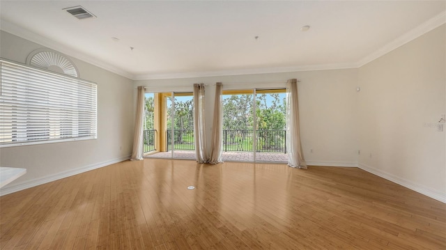 1512 3rd Street Cir E, Palmetto, FL 34221 - empty room with wood finished floors and crown molding