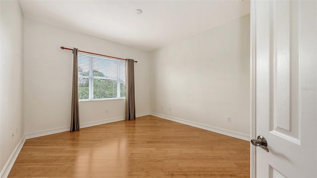 1512 3rd Street Cir E, Palmetto, FL 34221 - spare room featuring light wood finished floors and baseboards