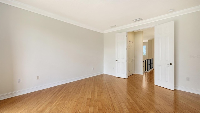 1512 3rd Street Cir E, Palmetto, FL 34221 - spare room featuring light wood finished floors, crown molding, and a smoke detector