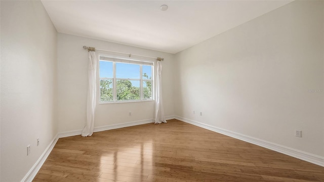 1512 3rd Street Cir E, Palmetto, FL 34221 - unfurnished room with hardwood / wood-style flooring and baseboards