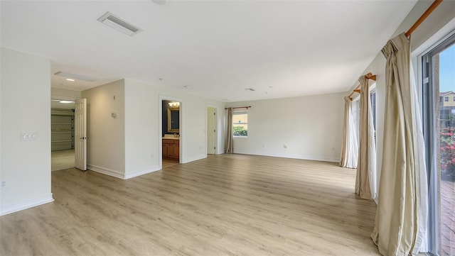 1512 3rd Street Cir E, Palmetto, FL 34221 - unfurnished living room featuring light wood finished floors