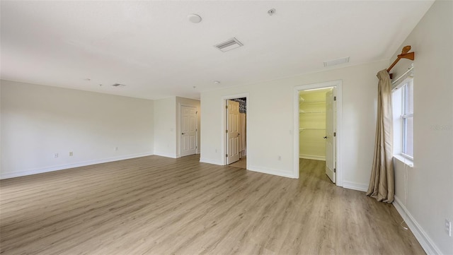 1512 3rd Street Cir E, Palmetto, FL 34221 - empty room featuring light wood-style flooring and baseboards