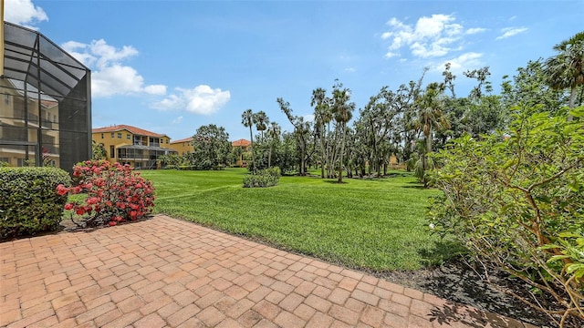1512 3rd Street Cir E, Palmetto, FL 34221 - view of green lawn featuring a patio area and a lanai