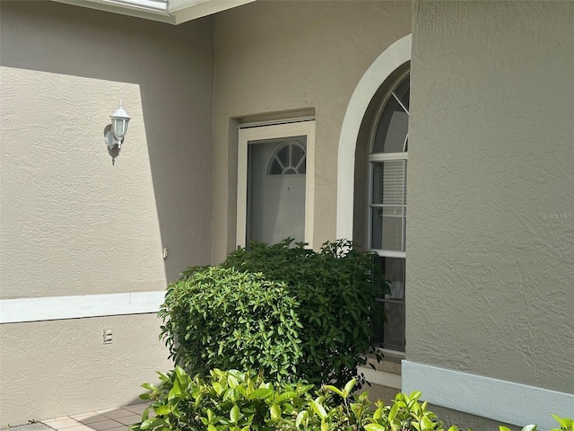 6908 Stoneywalk Ct, Bradenton, FL 34203 - doorway to property with stucco siding
