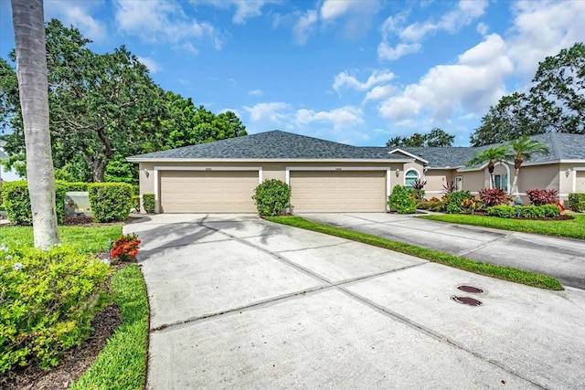 6908 Stoneywalk Ct, Bradenton, FL 34203 - ranch-style home with concrete driveway, stucco siding, an attached garage, and a shingled roof