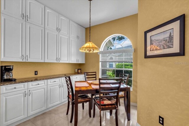 6908 Stoneywalk Ct, Bradenton, FL 34203 - dining area featuring light tile patterned floors