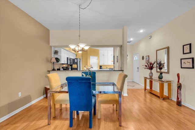 6908 Stoneywalk Ct, Bradenton, FL 34203 - dining room featuring light wood-type flooring, a chandelier, and recessed lighting