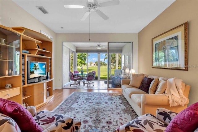 6908 Stoneywalk Ct, Bradenton, FL 34203 - living area with wood finished floors and ceiling fan