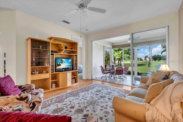 6908 Stoneywalk Ct, Bradenton, FL 34203 - living room with a ceiling fan and wood finished floors