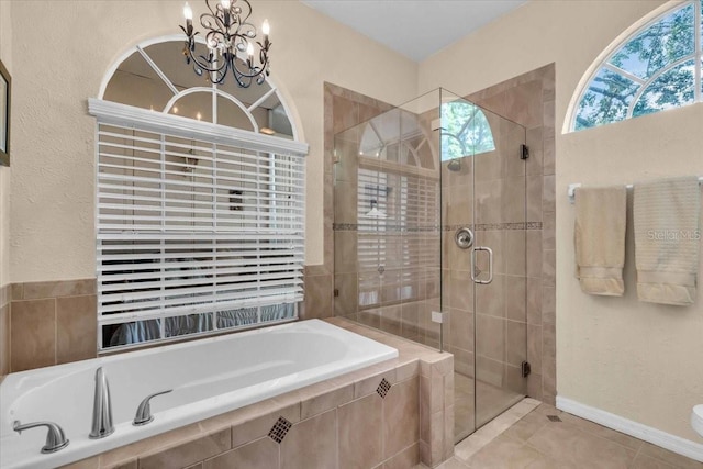 6908 Stoneywalk Ct, Bradenton, FL 34203 - bathroom featuring a shower stall, a chandelier, a bath, and tile patterned flooring