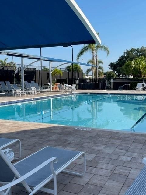 6908 Stoneywalk Ct, Bradenton, FL 34203 - community pool with a patio area