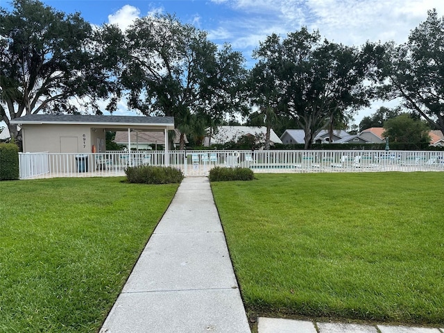 6908 Stoneywalk Ct, Bradenton, FL 34203 - view of front of home with a community pool and stucco siding