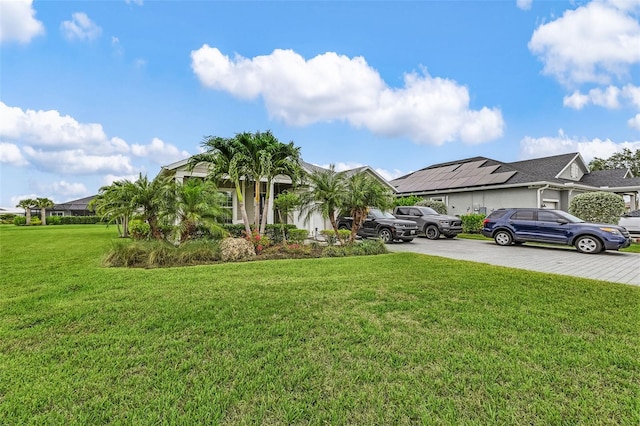 17204 Bullhorn Cir, Punta Gorda, FL 33982 - obstructed view of property featuring concrete driveway and a front lawn