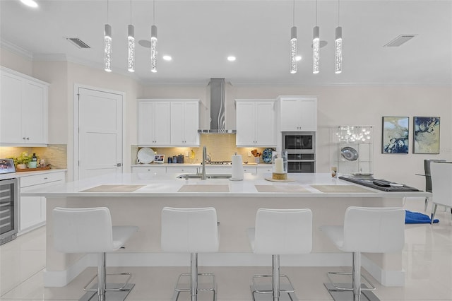 17204 Bullhorn Cir, Punta Gorda, FL 33982 - kitchen with wall chimney range hood, oven, crown molding, black microwave, and light countertops