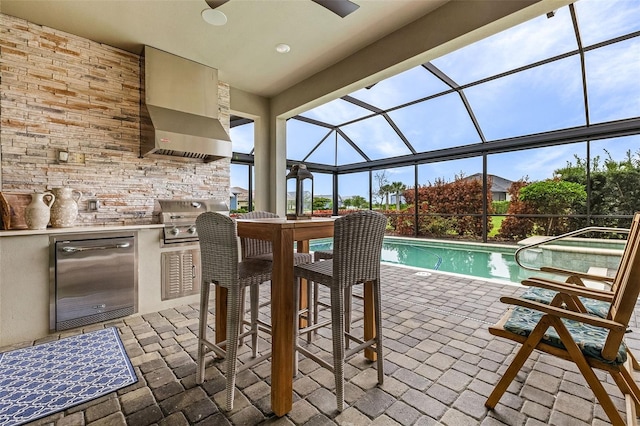 17204 Bullhorn Cir, Punta Gorda, FL 33982 - view of patio featuring exterior kitchen, ceiling fan, an outdoor pool, and glass enclosure