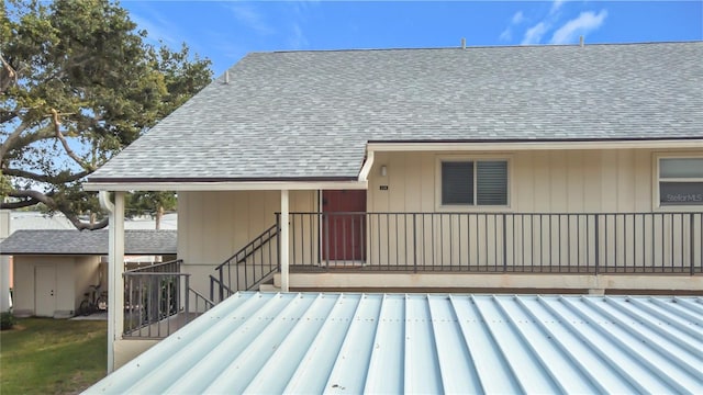 516 Parkdale Mews Unit 516, Venice, FL 34285 - back of property with roof with shingles and stairs