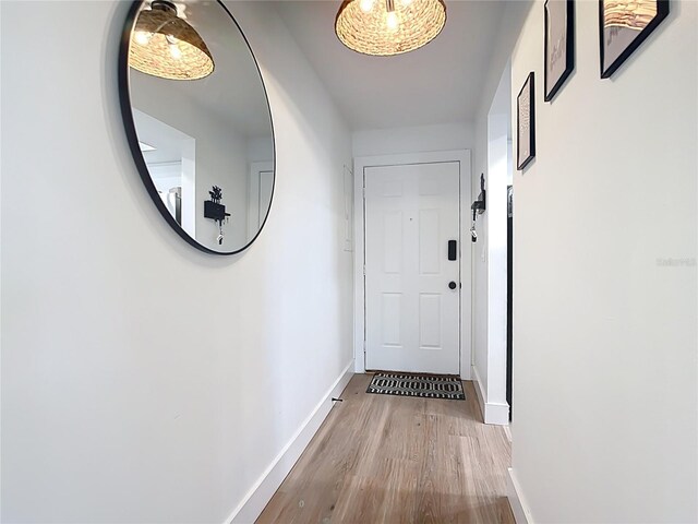 516 Parkdale Mews Unit 516, Venice, FL 34285 - doorway to outside featuring wood finished floors and baseboards
