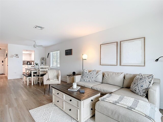 516 Parkdale Mews Unit 516, Venice, FL 34285 - living room with light wood-type flooring and ceiling fan