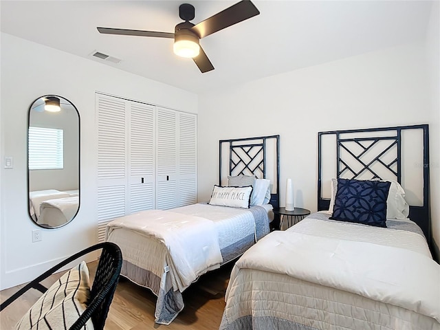 516 Parkdale Mews Unit 516, Venice, FL 34285 - bedroom with a closet, wood finished floors, and ceiling fan