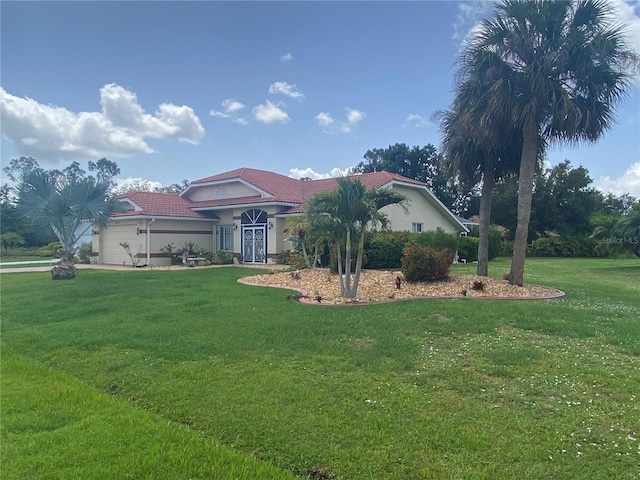 25433 Colon Dr, Punta Gorda, FL 33983 - mediterranean / spanish-style house with a tile roof, a front yard, and stucco siding