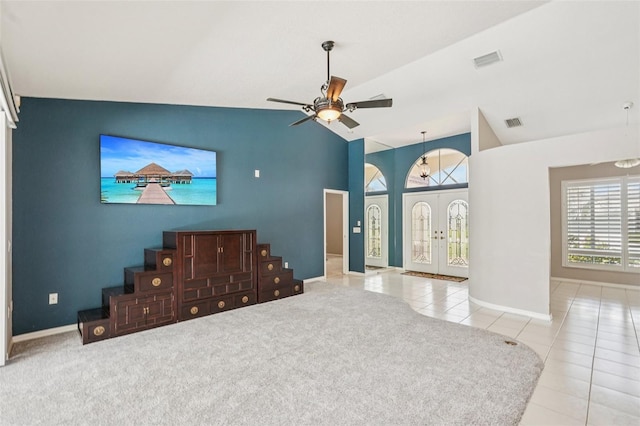 25433 Colon Dr, Punta Gorda, FL 33983 - unfurnished living room featuring tile patterned floors, lofted ceiling, a ceiling fan, and stairway