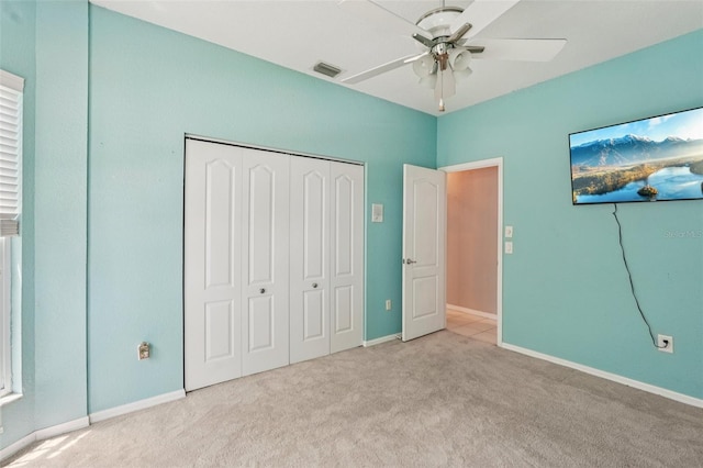 25433 Colon Dr, Punta Gorda, FL 33983 - unfurnished bedroom with carpet flooring, a closet, and a ceiling fan