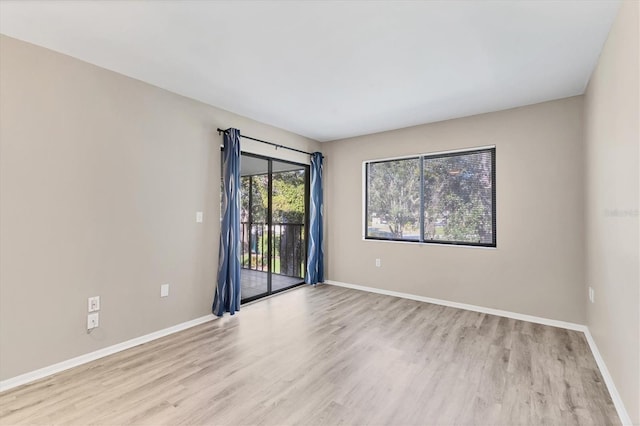 7866 Eagle Creek Dr Unit 7866, Sarasota, FL 34243 - spare room featuring light wood-style flooring and baseboards