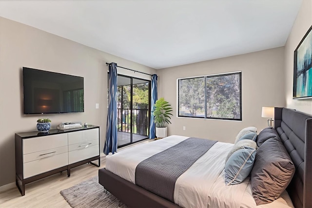 7866 Eagle Creek Dr Unit 7866, Sarasota, FL 34243 - bedroom featuring access to outside and light wood-style floors