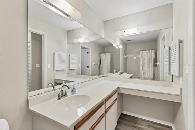 7866 Eagle Creek Dr Unit 7866, Sarasota, FL 34243 - bathroom with wood finished floors, vanity, and a shower with shower curtain