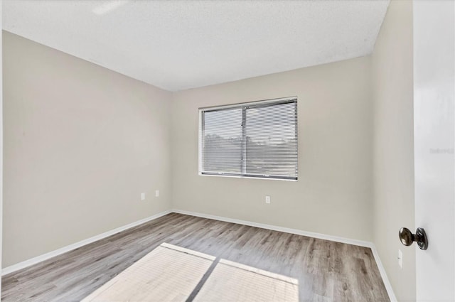7866 Eagle Creek Dr Unit 7866, Sarasota, FL 34243 - spare room with wood finished floors and baseboards