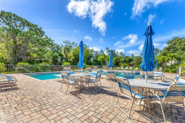7866 Eagle Creek Dr Unit 7866, Sarasota, FL 34243 - community pool featuring a patio and view of scattered trees